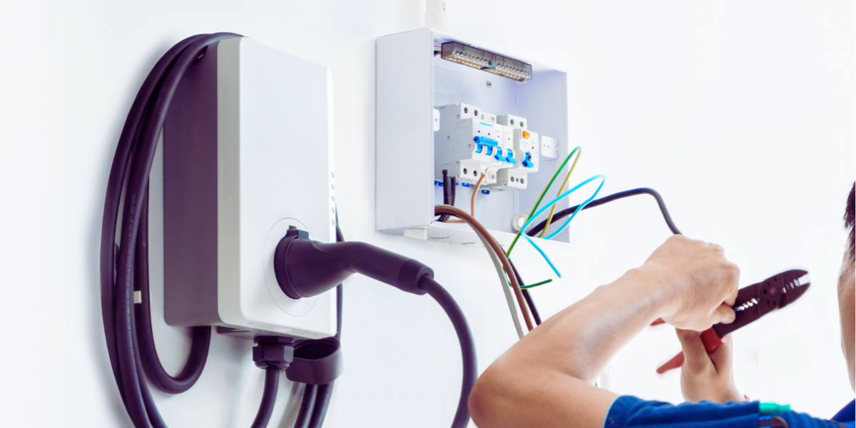 electrician performing ev charger installation for Daytona, FL home
