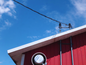 Damaged service masts on top of Florida home