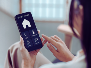 Woman controlling smart lights with phone